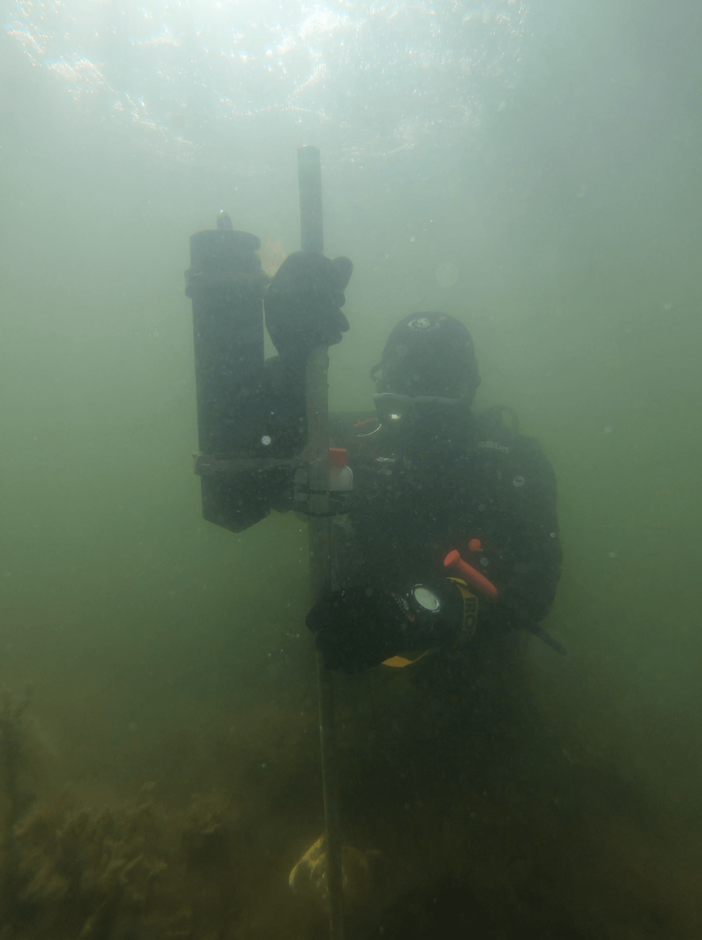 Deploying pressure and light loggers as well as sediment traps.